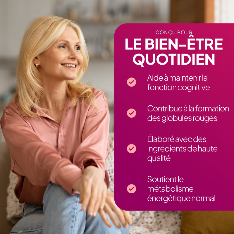 Une femme blonde souriante, vêtue d'un chemisier rose et d'un jean, est assise à l'intérieur, à côté d'un grand panneau promotionnel rose de style français sur lequel figurent des informations concernant les bienfaits du bien-être au quotidien.